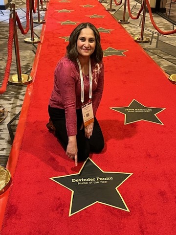 Devinder-posing-with-award-star.jpg